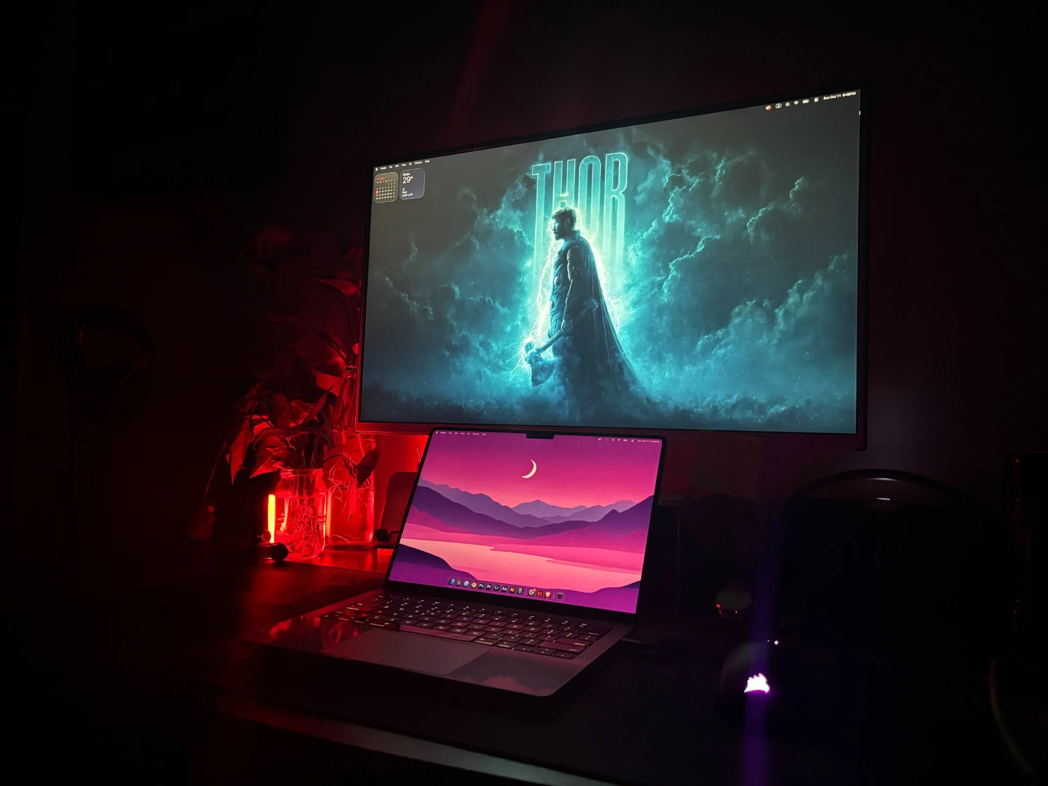 Tasnemul Tonmoy’s dark creative desk setup with a monitor and laptop